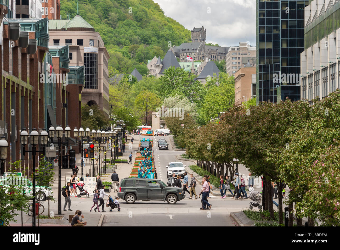 Montreal, CA - 27 May 2017: Urban walkway project Fleuve-Montagne on McGill College Avenue with Mont Royal mount in the background. Stock Photo