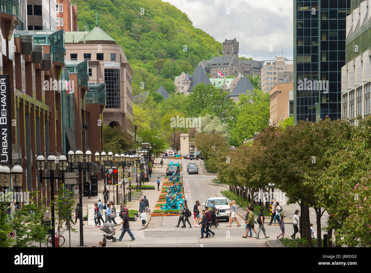 Montreal, CA - 27 May 2017: Urban walkway project Fleuve-Montagne on McGill College Avenue with Mont Royal mount in the background. Stock Photo