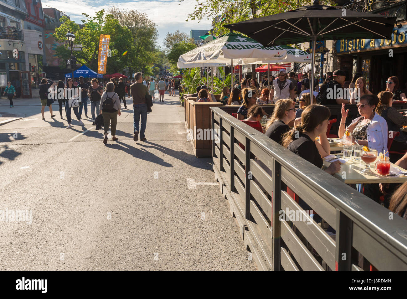 Montreal, CA - 27 May 2017: St-Denis street is turned into a pedestrain zone during 'Terrasses au Quartier Latin' event Stock Photo