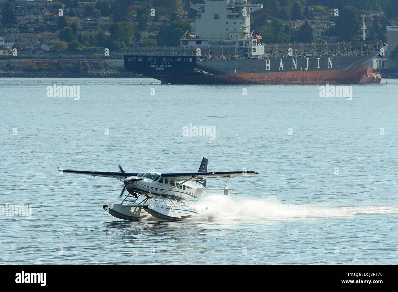 Seair Seaplanes Cessna 208 Caravan Floatplane Landing At Vancouver Harbour Flight Centre, British Columbia, Canada. Stock Photo