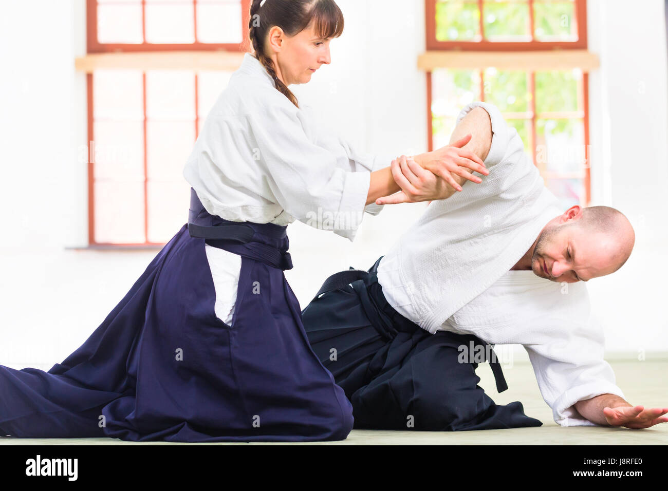 Man and woman fighting at Aikido martial arts school Stock Photo