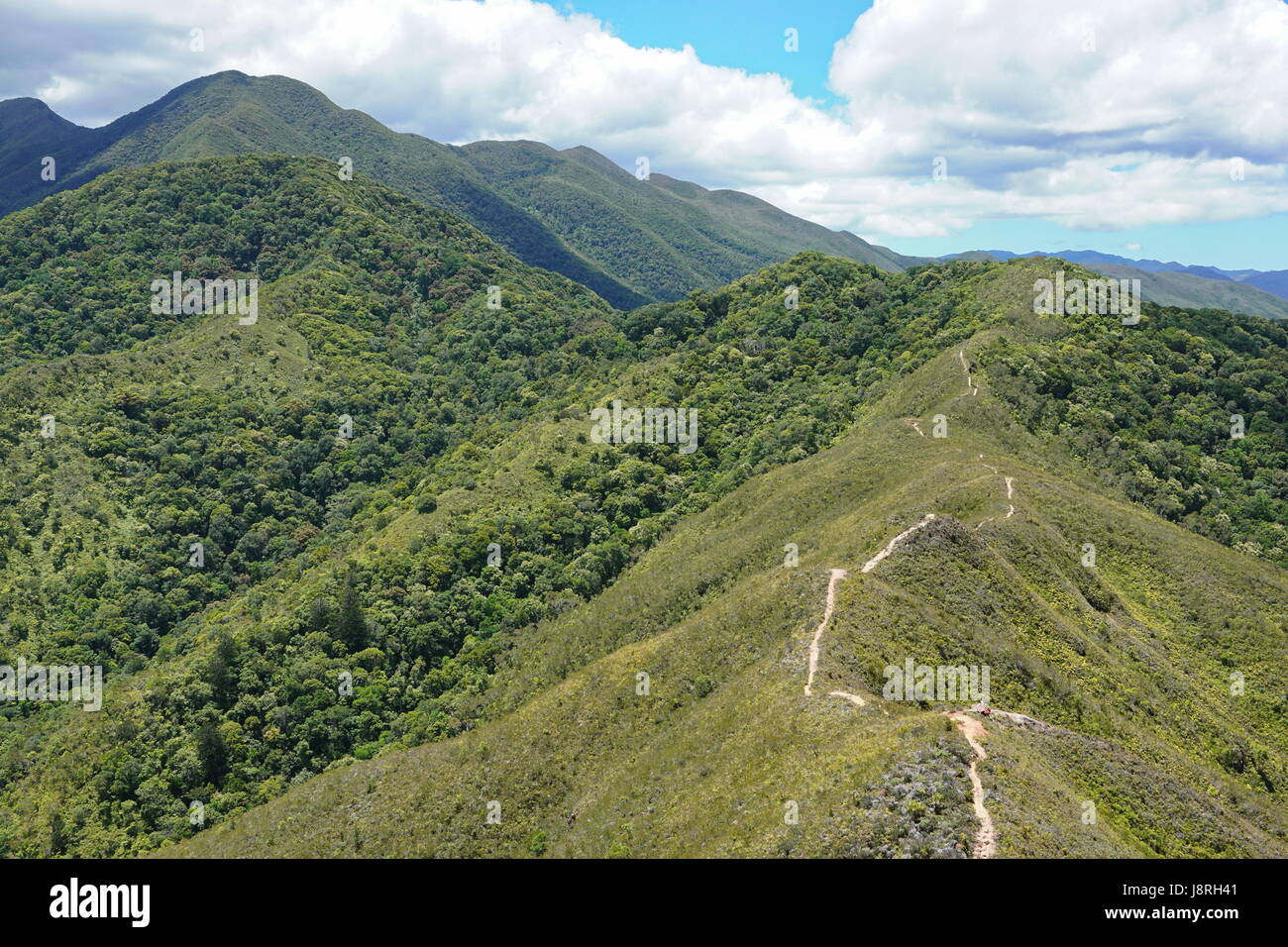 Mountain landscape in New Caledonia with a footpath along the crest and the mount Koghi on the left, Noumea, Grande Terre island, south Pacific Stock Photo