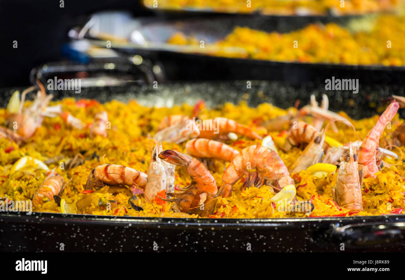 Seafood paella sold at street market stand Stock Photo Alamy