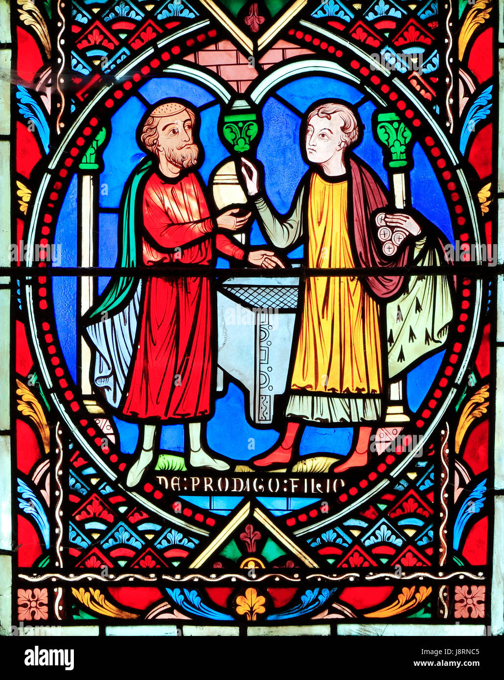 Parable of The Prodigal Son, by Adolph Didron of Paris, 1859.  Stained glass window, Feltwell Church, Norfolk, Prodigal Son receives his inheritance Stock Photo