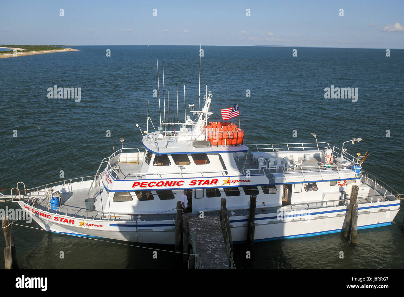 The Peconic Star Express, which brings passengers from the East End Seaport Museum in Greenport to Longbeach Bar Lighthouse. Long Island, New York. Stock Photo