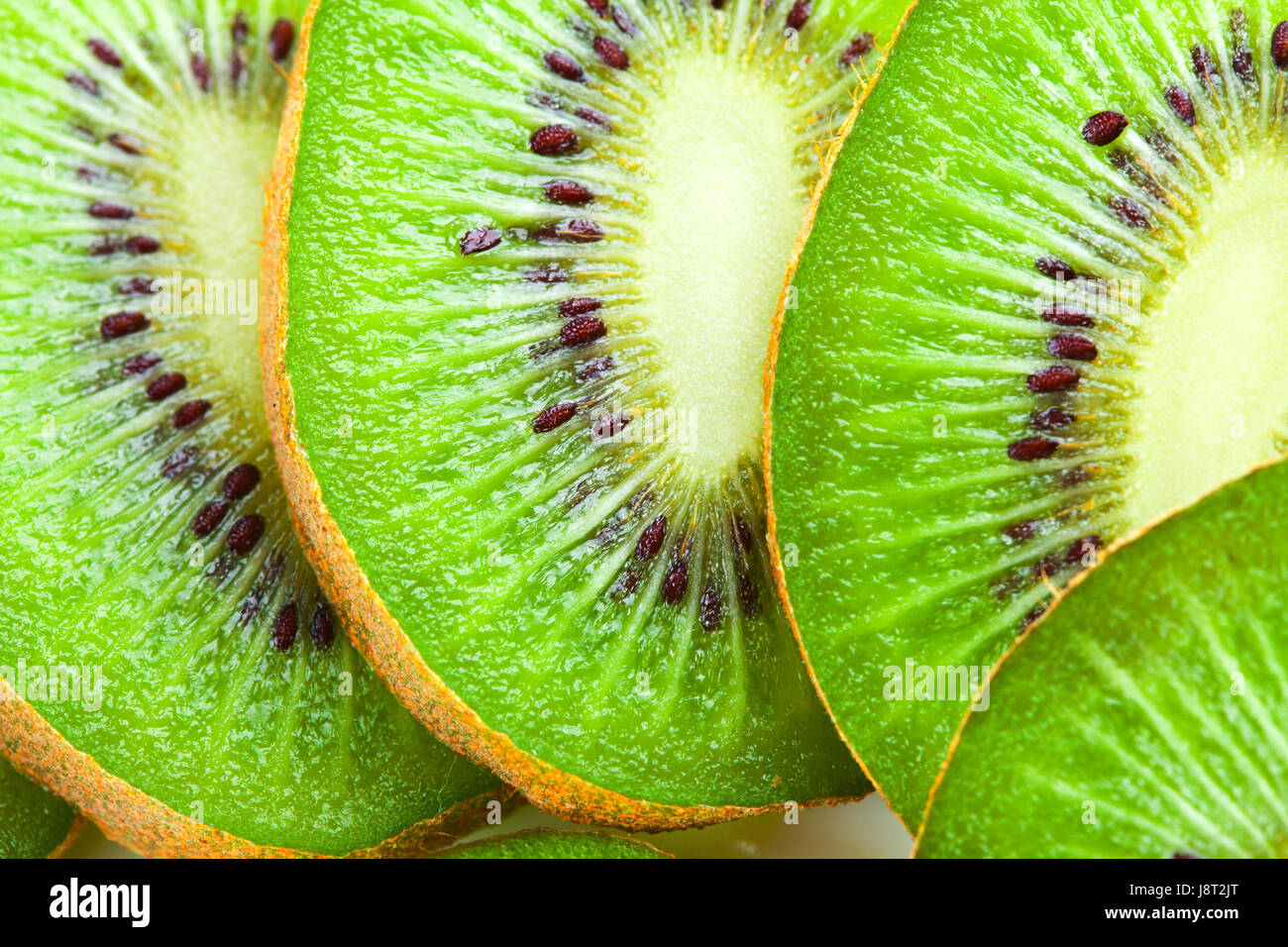 Kiwi slices as background Stock Photo