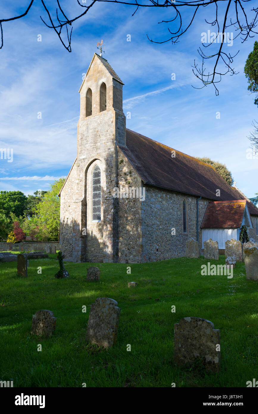Th Church of St Mary in the village of Chidham on a bright spring evening, West Sussex, UK Stock Photo
