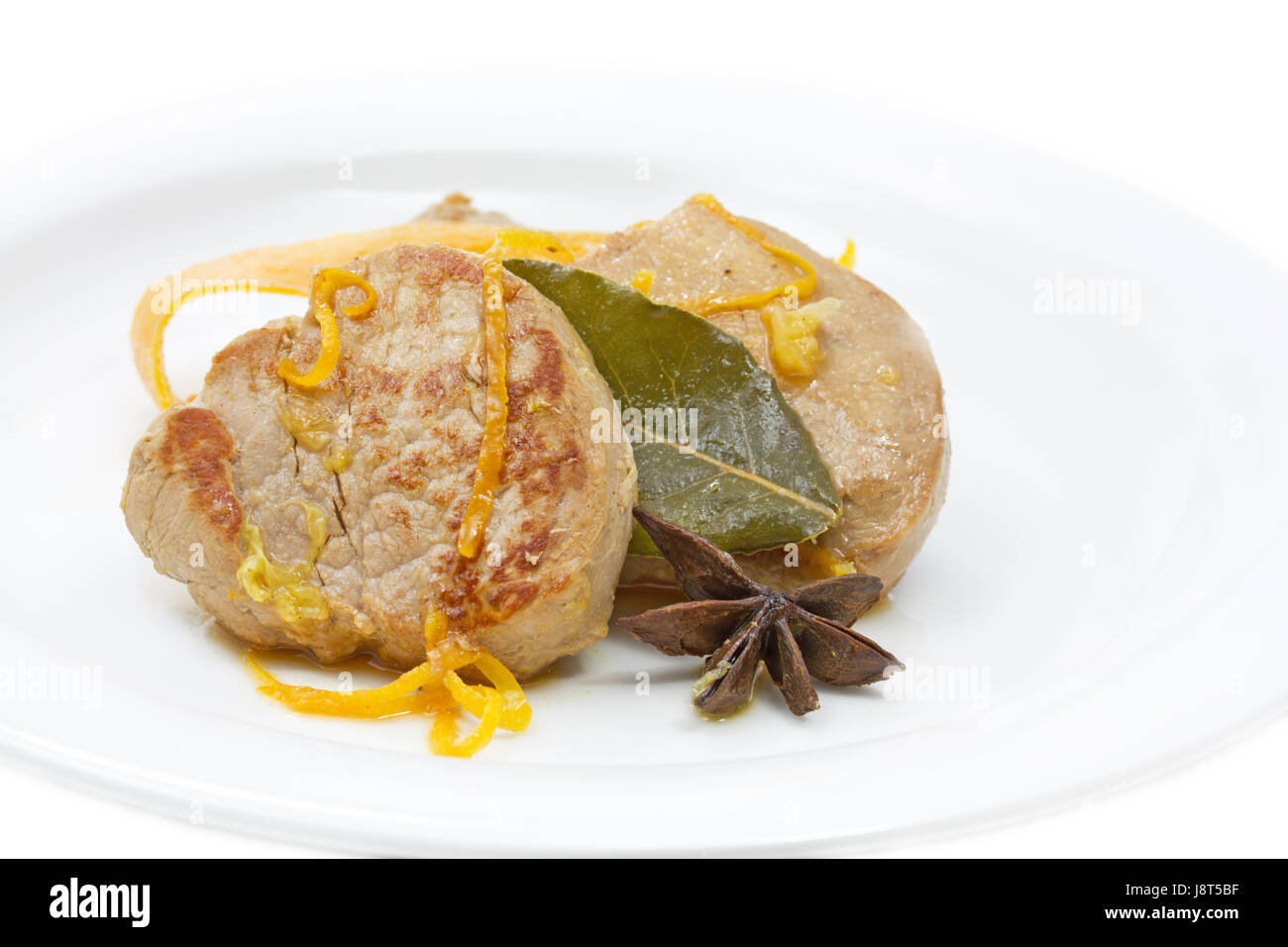 pork with orange peel and bay leaf Stock Photo