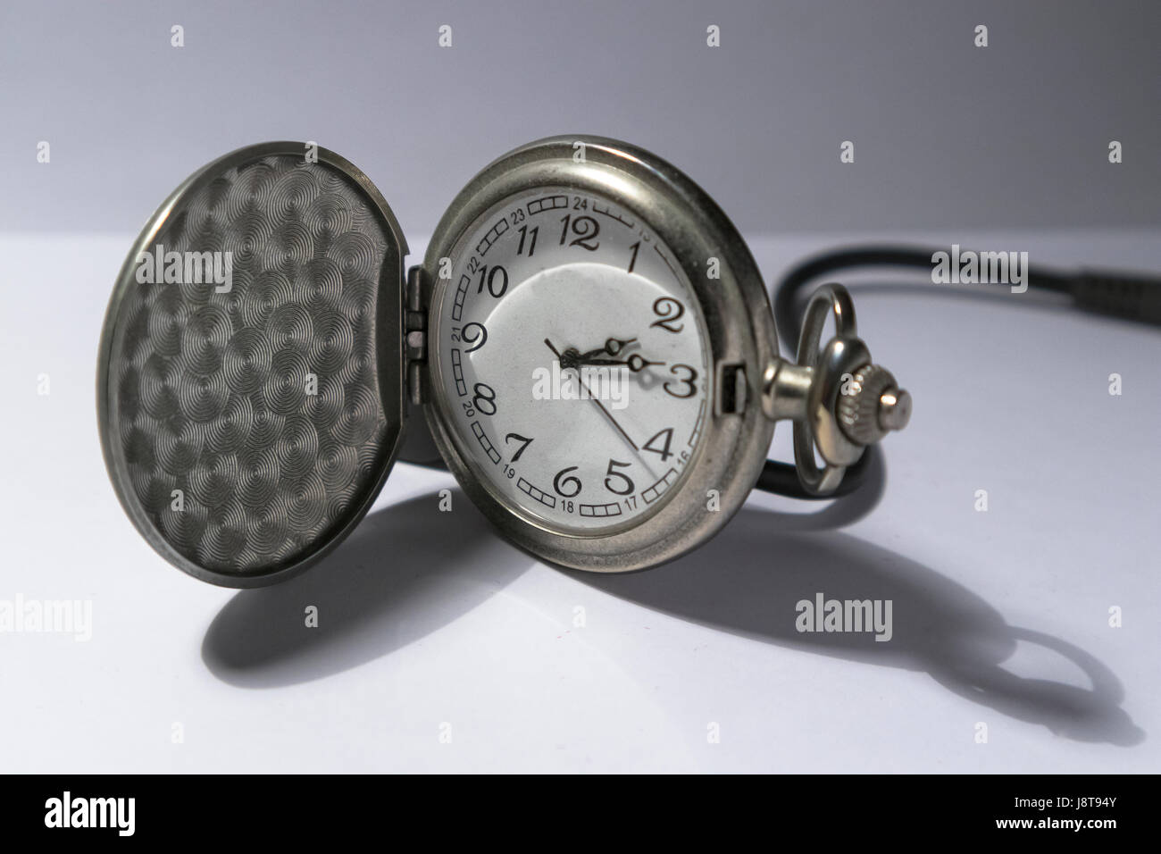Silver pocket watch isolated on white background Stock Photo - Alamy