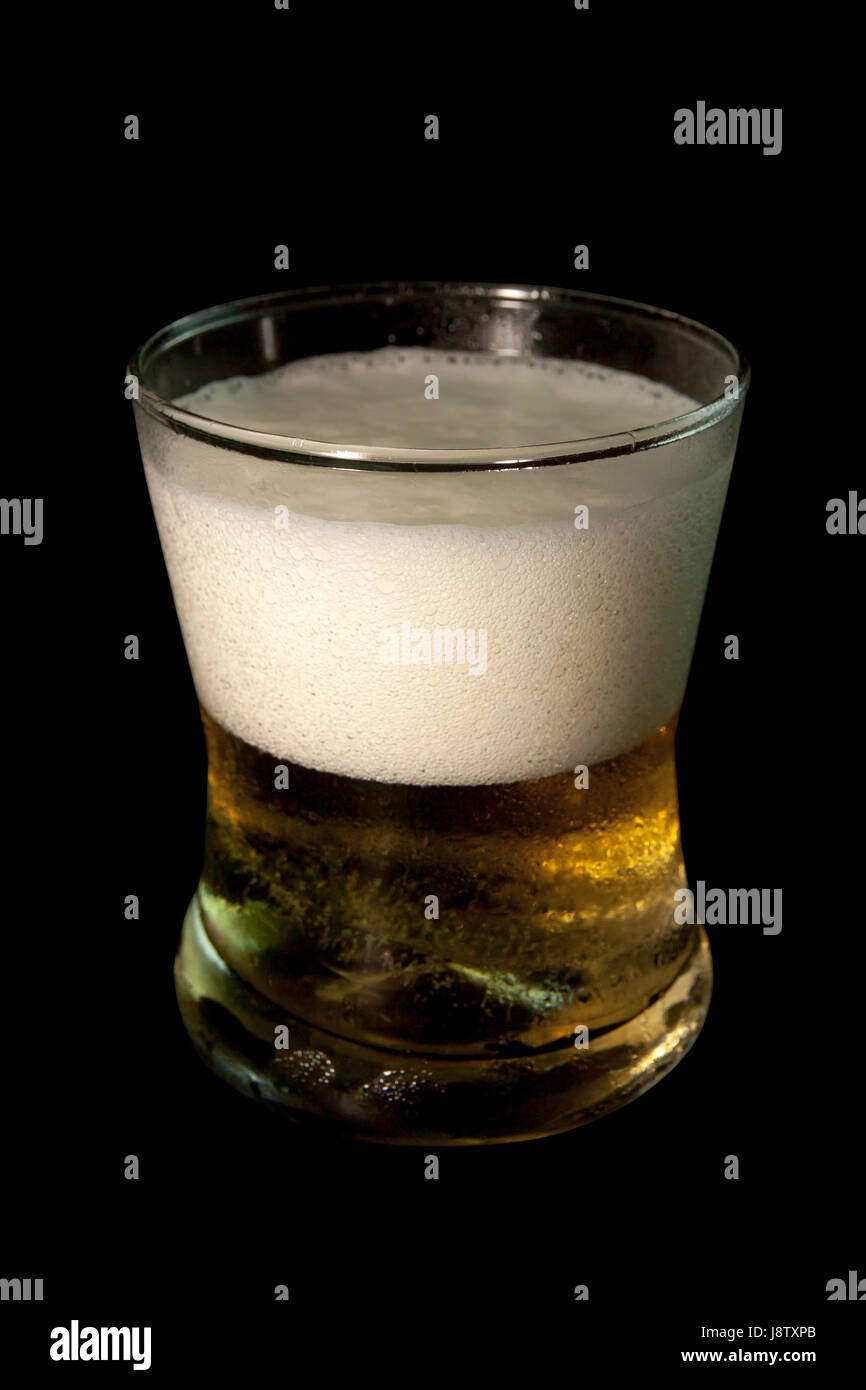Beer in glass isolated on black background. Pour beer. objects with clipping paths. Stock Photo