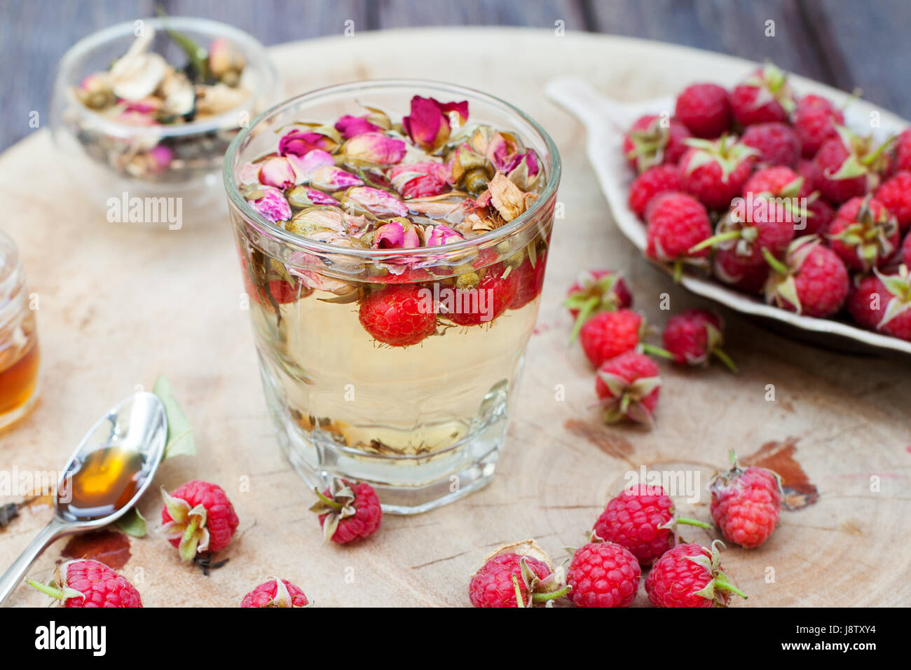 Red Rose Tea Raspberry Tea Herbal tea with rose buds and fresh raspberry Stock Photo - Alamy