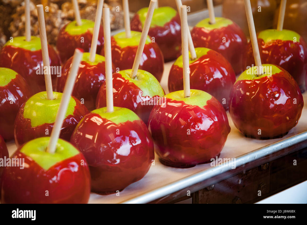 Toffee apples on shop counter, close-up Stock Photo