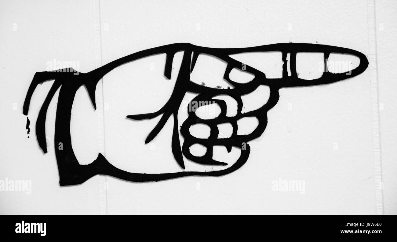 Sign with hand, finger pointing Stock Photo