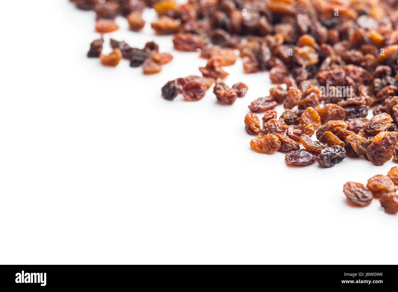 Sweet dried raisins isolated on white background. Stock Photo