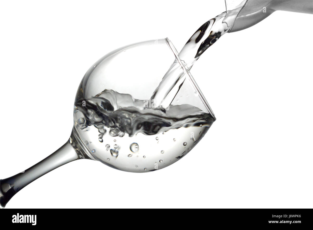 Colorless liquid, water,vodka is poured into a glass, liquid in a ...