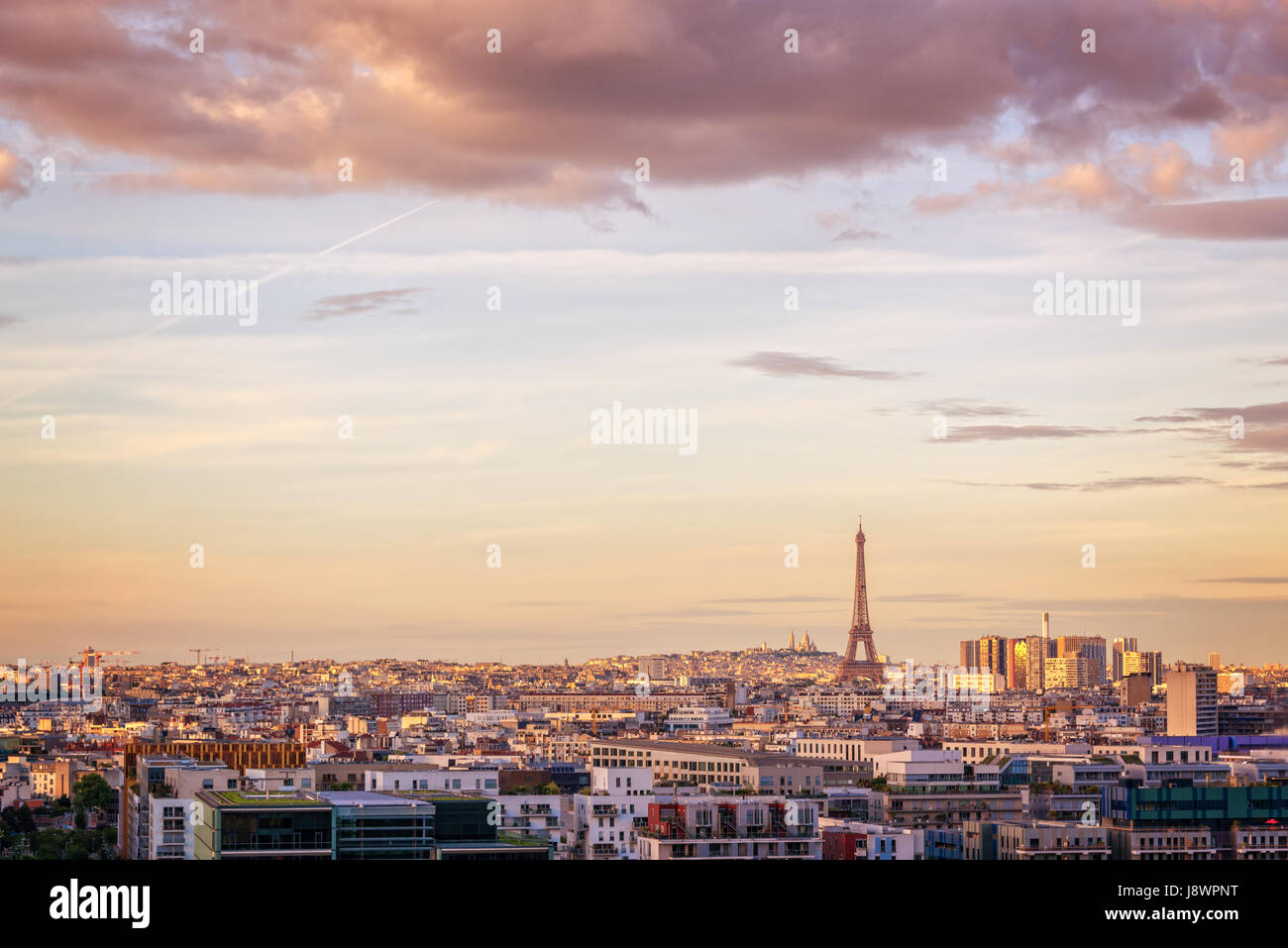 Aerial scenic view of Paris with the Eiffel tower at sunset, Montmartre in the background, France and Europe city travel concept Stock Photo