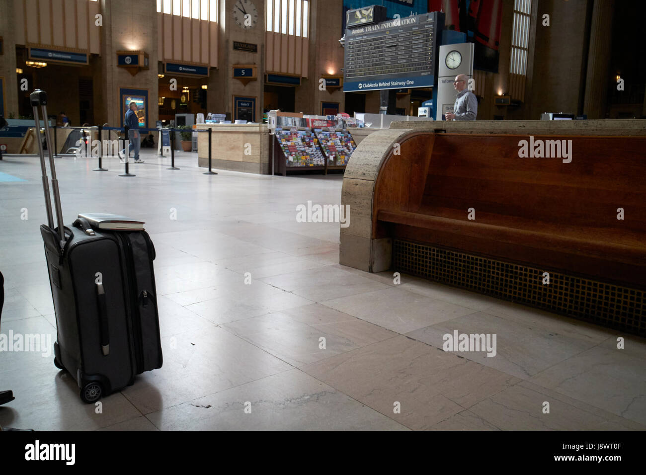 long wooden benches in main waiting room inside septa 30th street train station Philadelphia USA Stock Photo