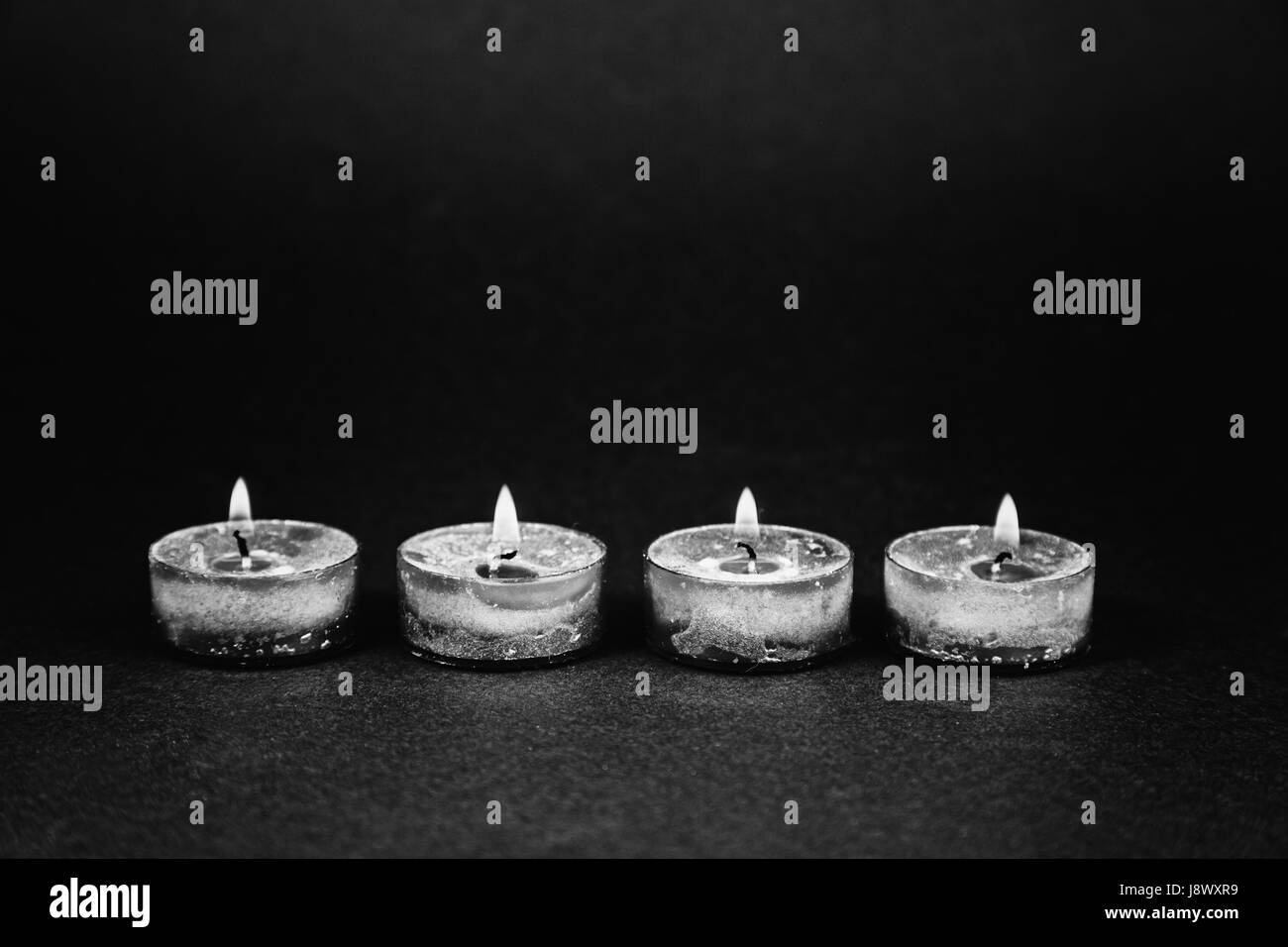Burning candles, detail of christmas celebration, fire and light Stock