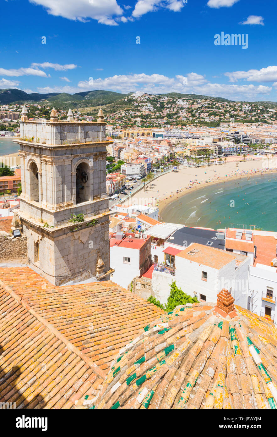 Views over the Hermitage of Our Lady of the Ermitana bell tower, and old town towards waterfront beach side hotels of Playa Norte, Peniscola, Spain Stock Photo