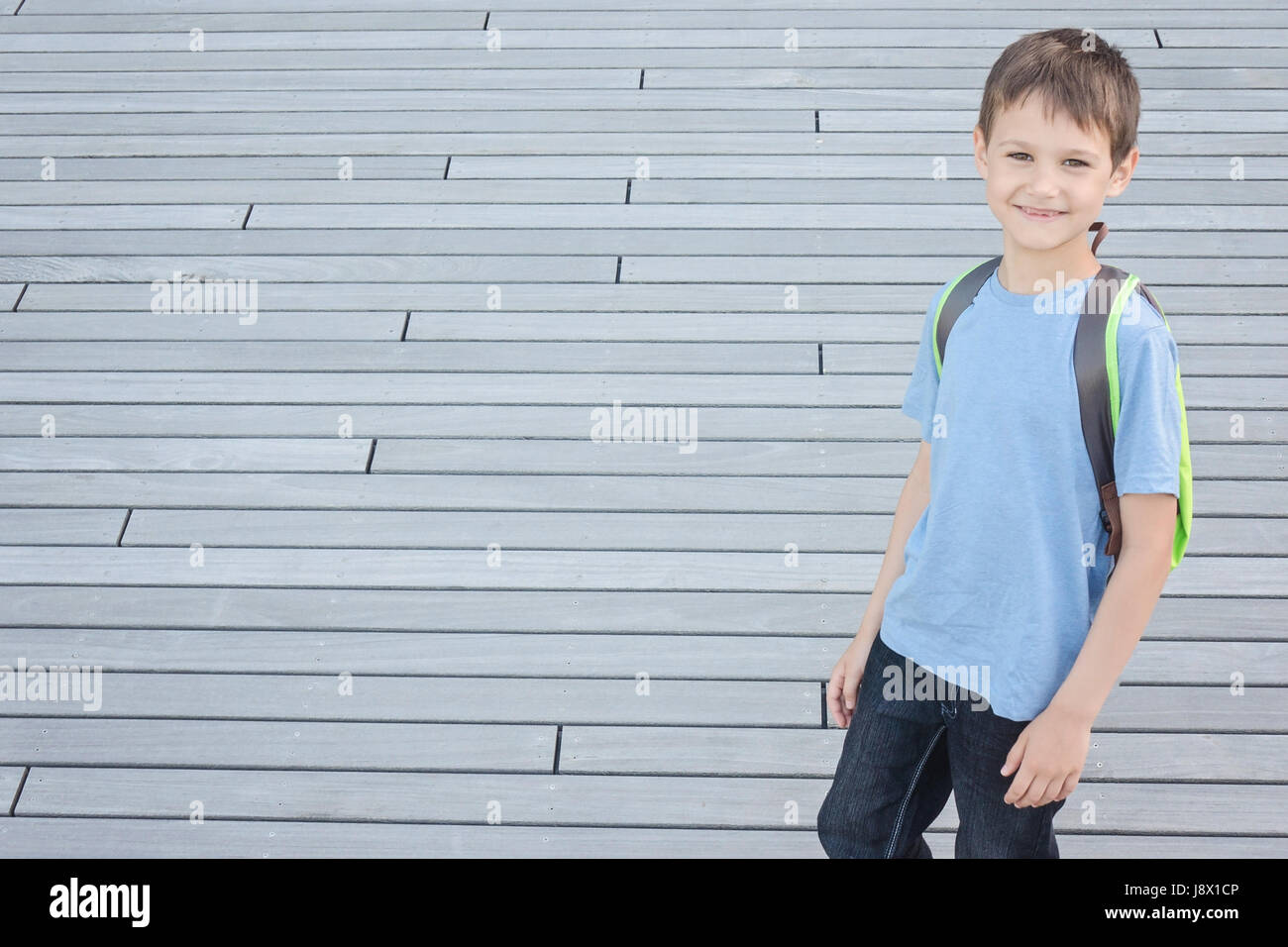 Smiling little boy with backpack Stock Photo Alamy