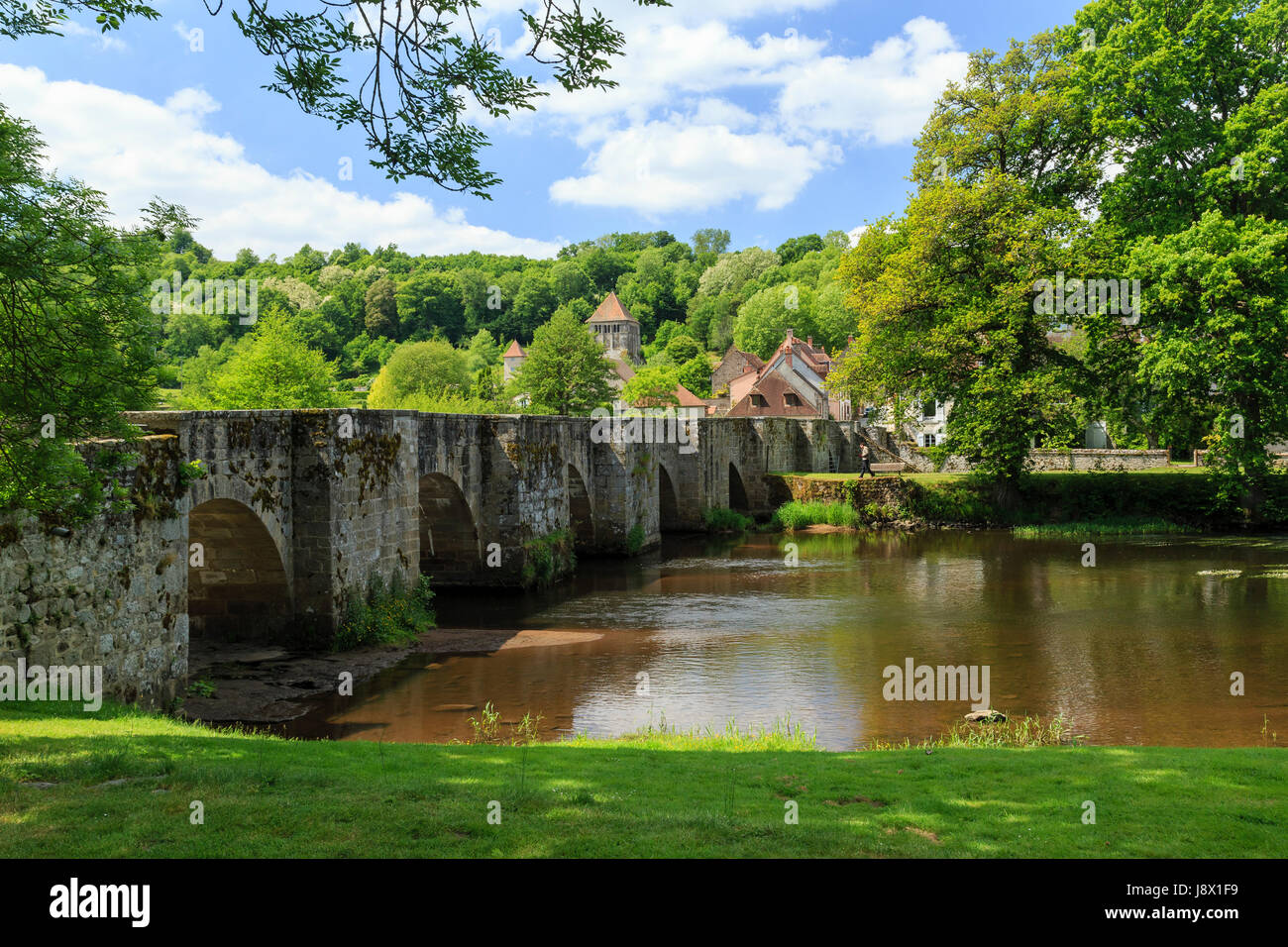 France, Creuse, Moutier-d'Ahun, romanesque bridge over the Creuse and the village Stock Photo