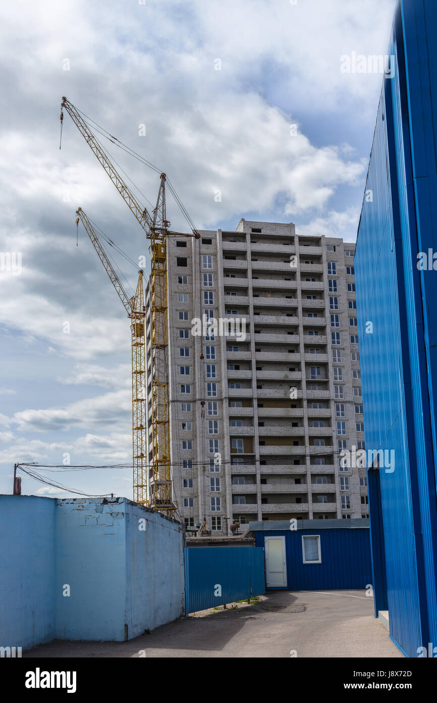 Industrial landscape, construction of high-rise buildings and cranes ...