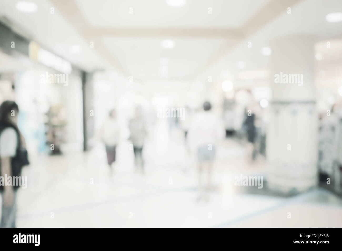 Blurred image background, people at shopping mall blur background with bokeh and vintage tone. Stock Photo