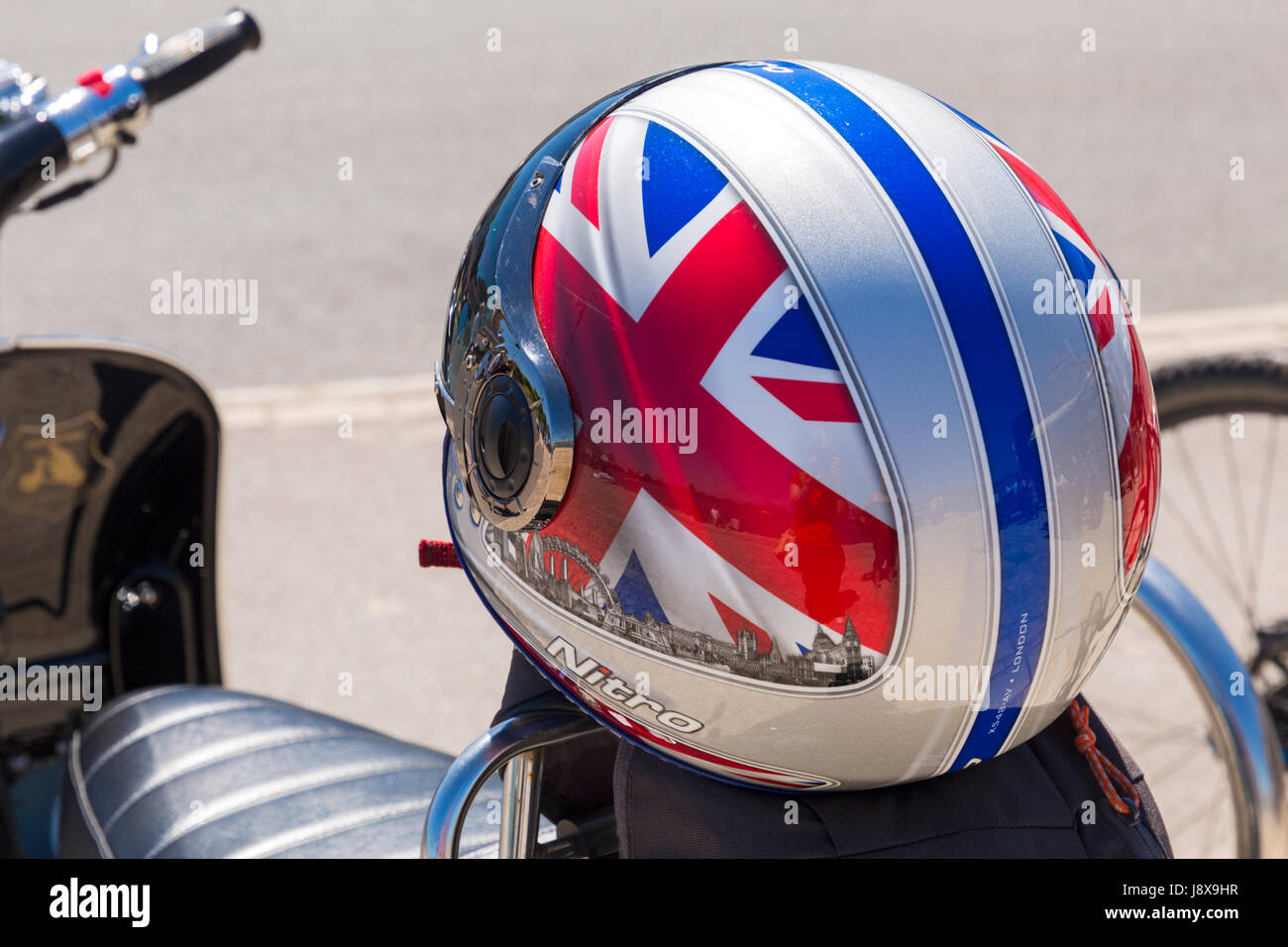 crash helmet with Union Jack on on motorbike at Swanage in May Stock Photo