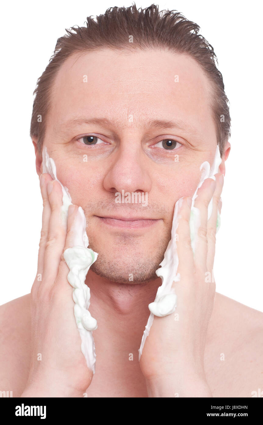 man rubbing shaving cream on his cheeks Stock Photo Alamy