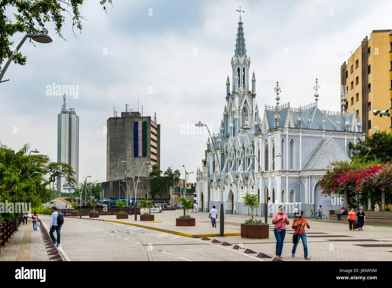 Cali, Colombia - February 6, 2014: People in a street in front of the La Ermita Church in city of Cali, Colombia Stock Photo