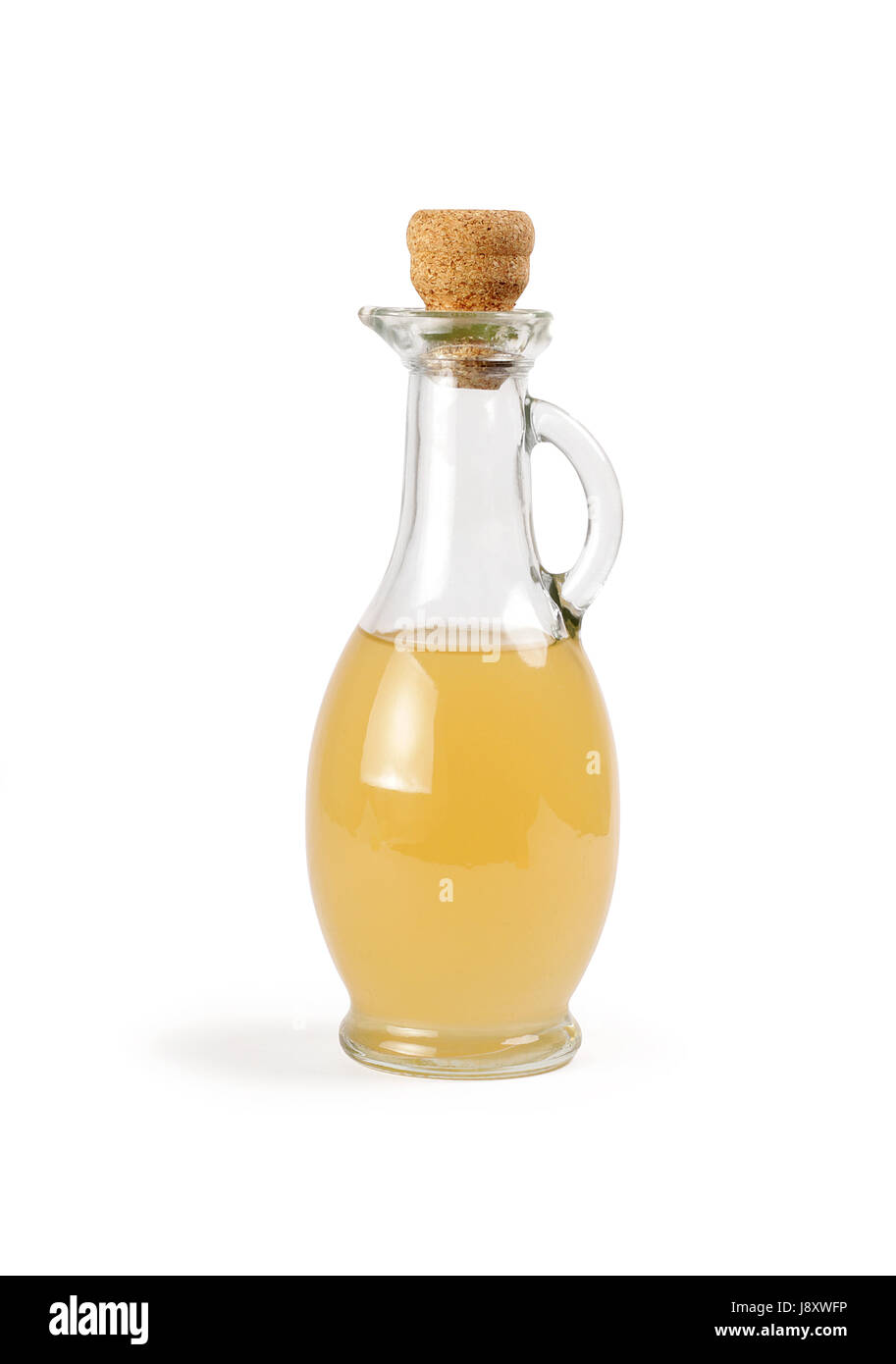 Decanter with apple vinegar isolated. Stock Photo