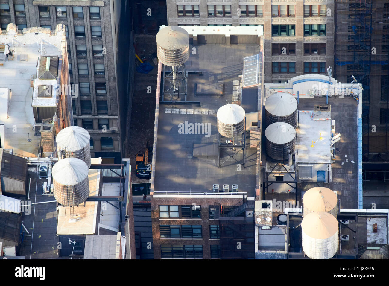 water towers including wooden ones on top of buildings in midtown manhattan New York City USA Stock Photo