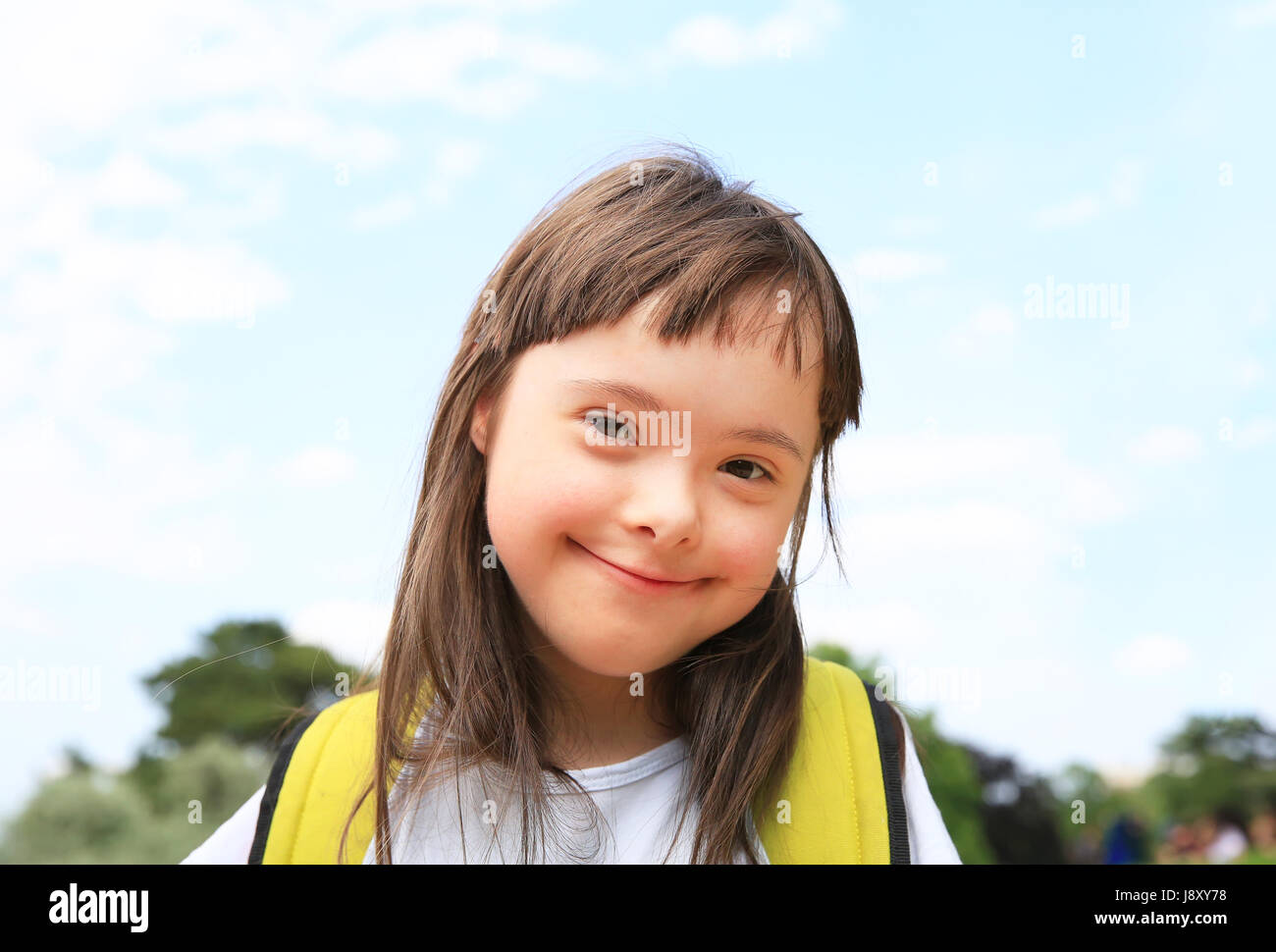 Portrait of little girl smiling outside Stock Photo - Alamy