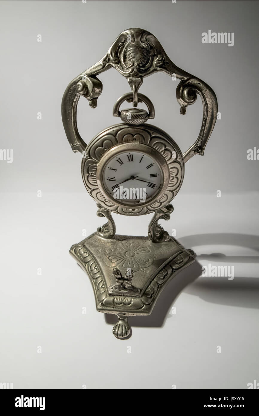 Antique silver table clock isolated on white background Stock Photo - Alamy