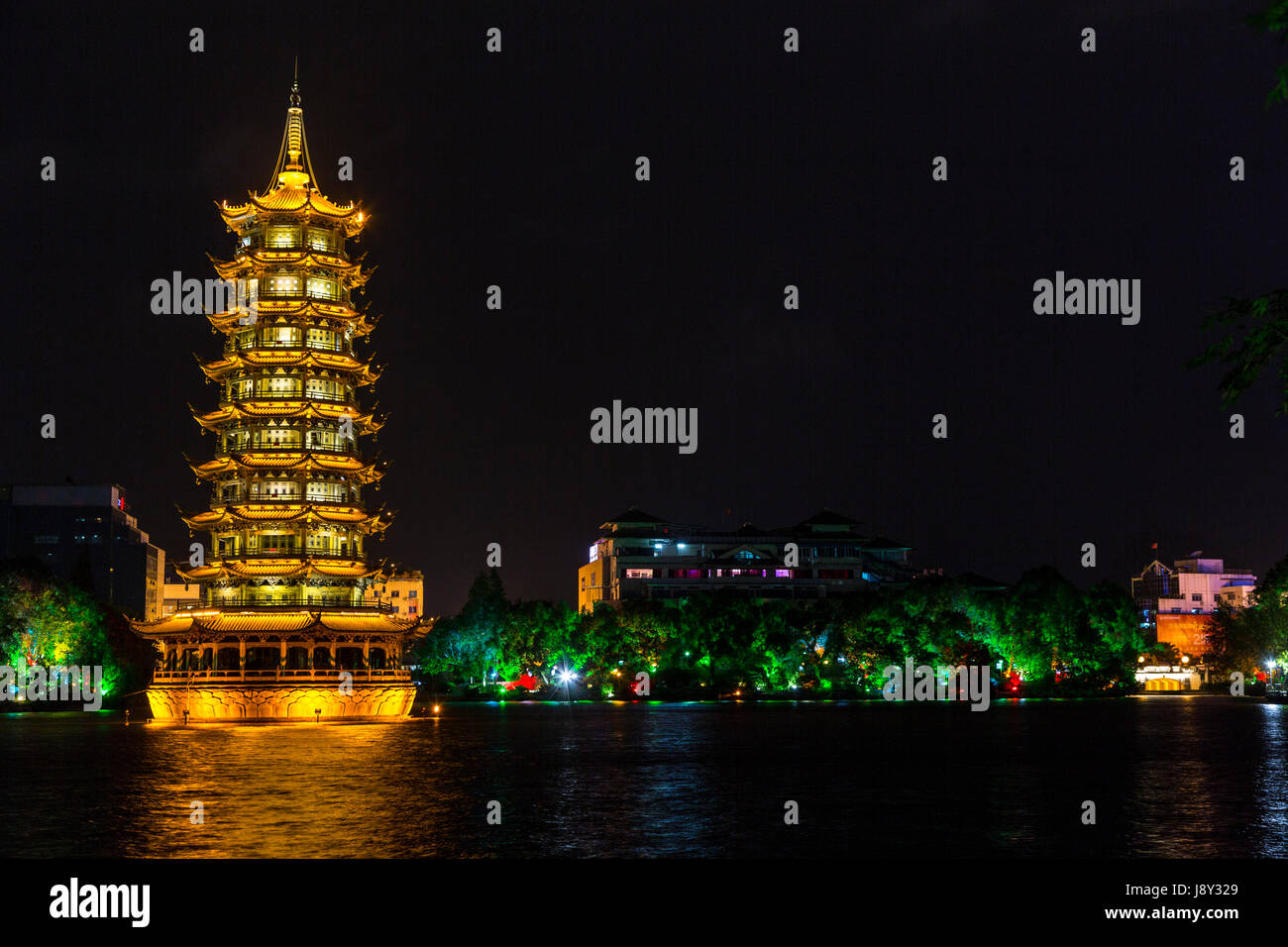 Guilin, China.  Sun Pagoda beside Fir Lake, at Night. Stock Photo