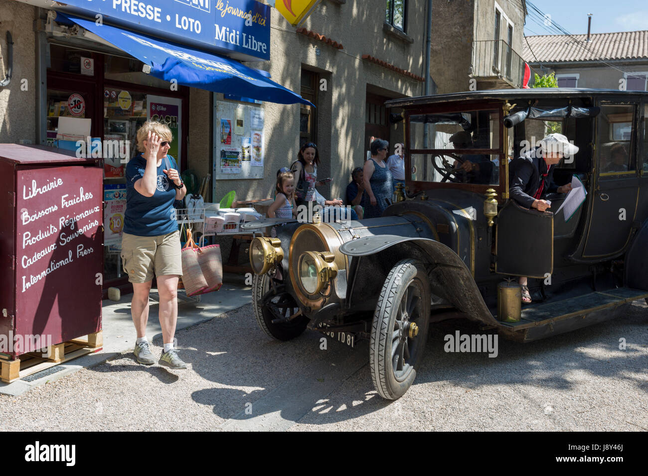 A visiting 1912 Delauney Belleville vintage car visits a French village, during a three-day rally journey through the Corbieres wine region, on 26th May, 2017, in Lagrasse, Languedoc-Rousillon, south of France. Lagrasse is listed as one of France's most beautiful villages and lies on the famous Route 20 wine route in the Basses-Corbieres region dating to the 13th century. Stock Photo