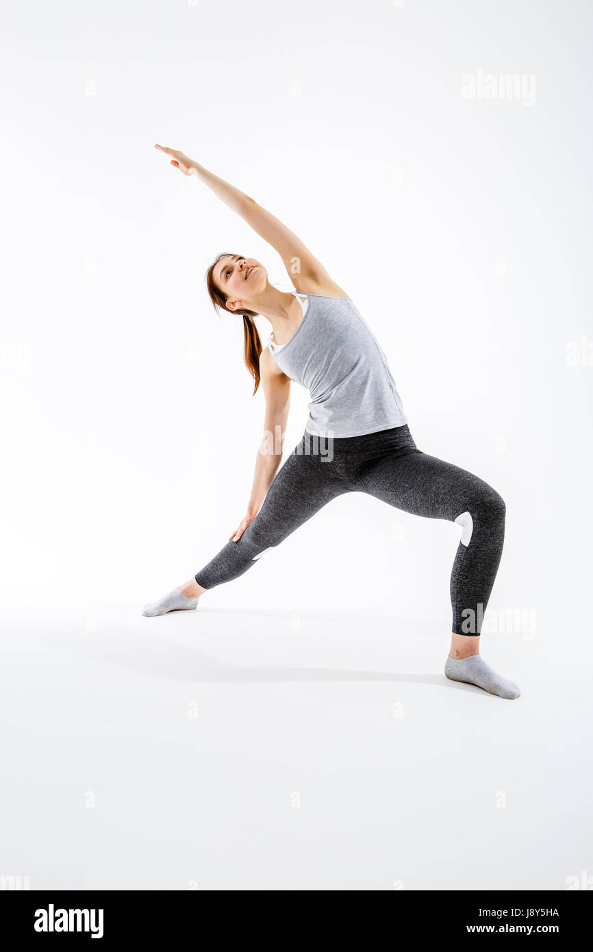 Young girl practicing in yoga on blank background Stock Photo - Alamy
