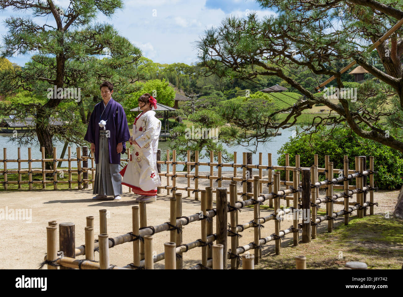 Young Japanese couple in traditional dress, Yukata Kimono, being photgraphed prior to their wedding. Stock Photo