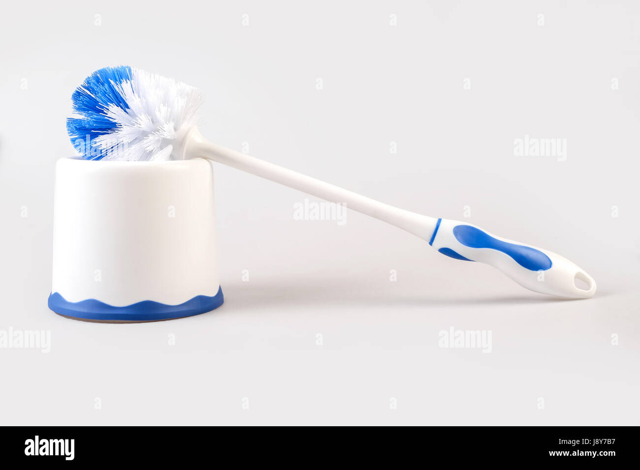 Plastic blue toilet brush isolated on white background Stock Photo