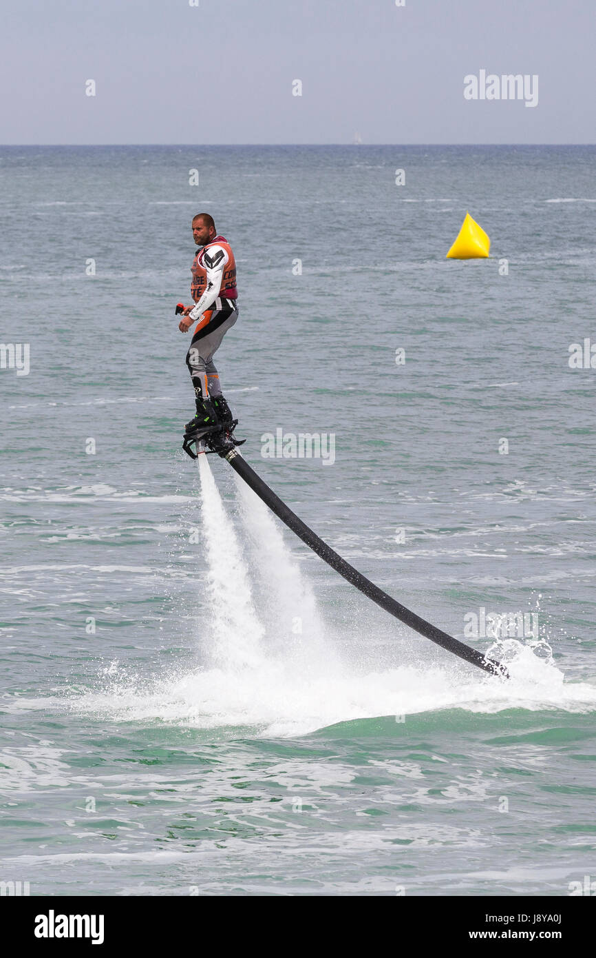 Flyboard Rider Illustrative editorial image. a fly board rider at sea Stock Photo - Alamy