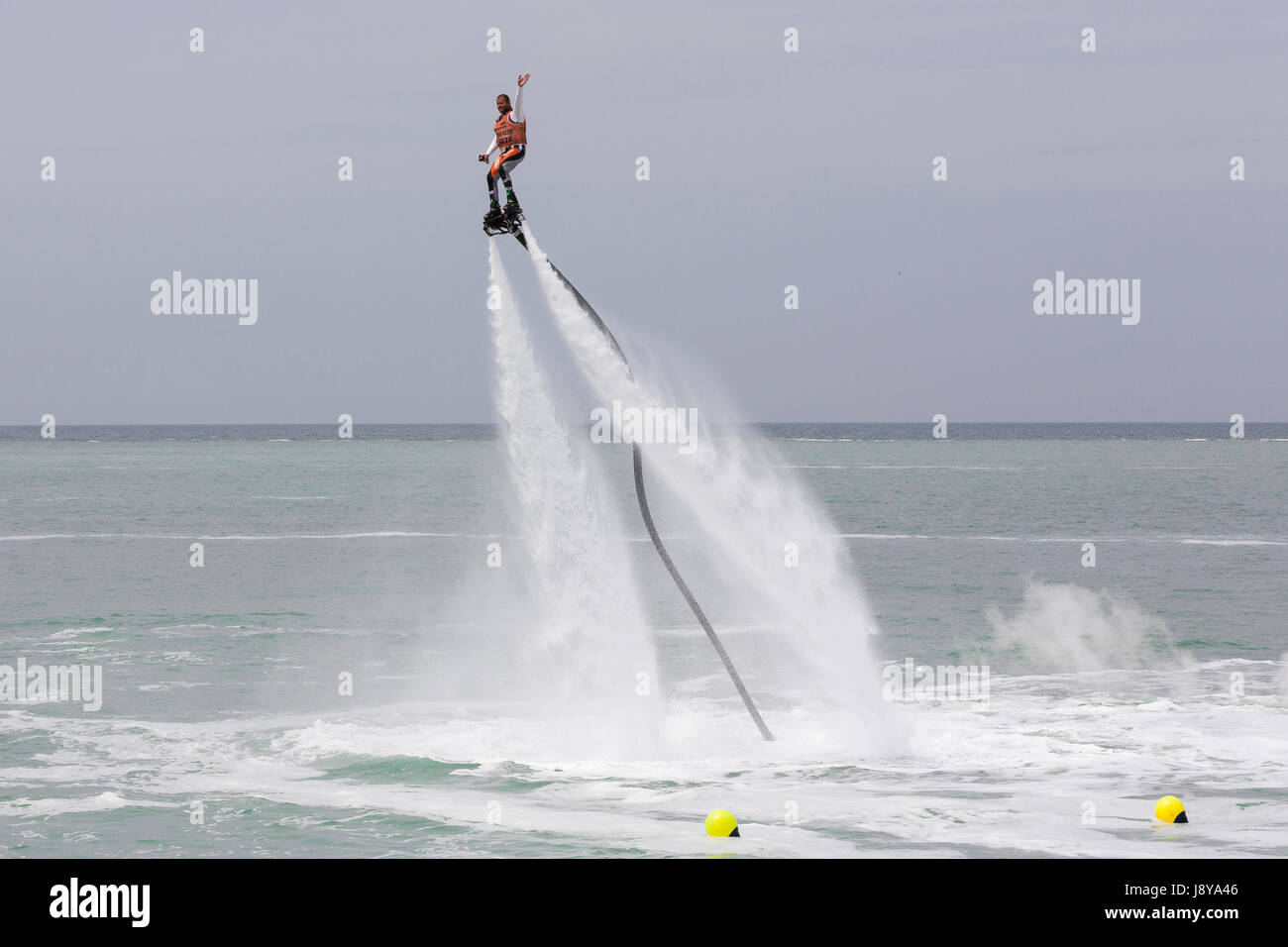 Flyboard Rider Illustrative editorial image. a fly board rider at sea Stock Photo - Alamy