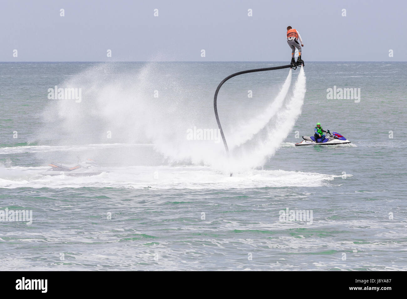 Flyboard Rider Illustrative editorial image. a fly board rider at sea Stock Photo - Alamy