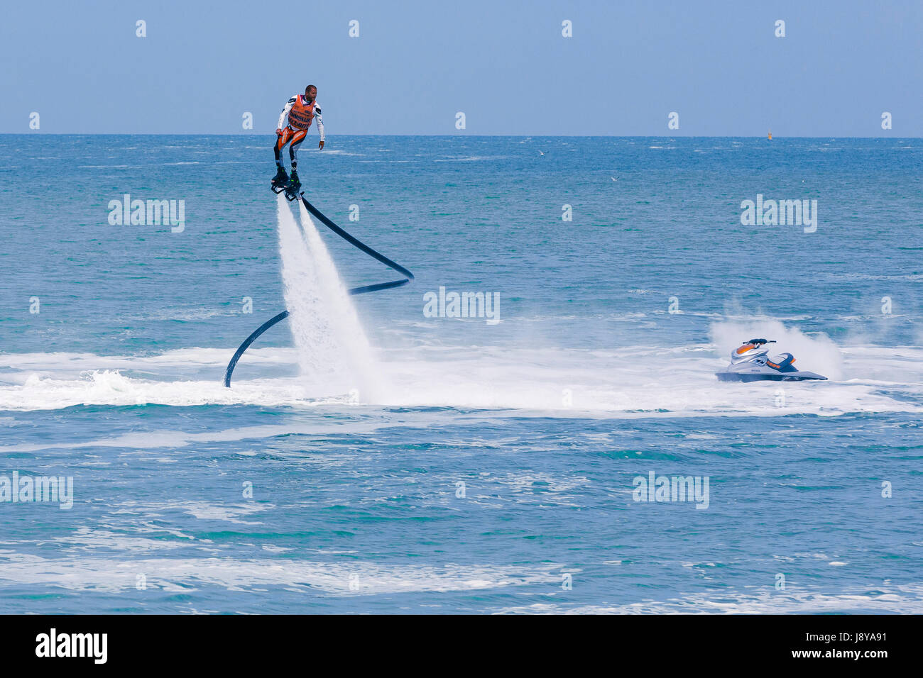 Flyboard Rider Illustrative editorial image. a fly board rider at sea Stock Photo - Alamy