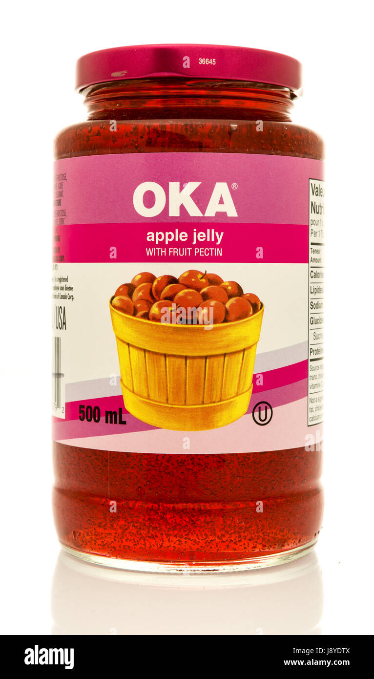 Winneconne, WI - 16 May 2017: A jar of OKA apple jelly with fruit pectin on an isolated background. Stock Photo