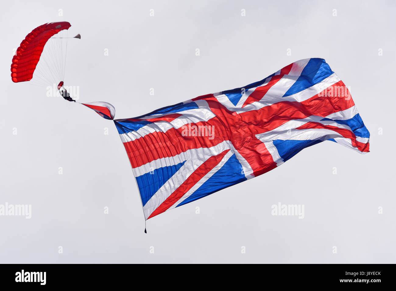 The Red Devils parachute team with the largest flag used by any team, here using the 5000 sq ft union flag Stock Photo