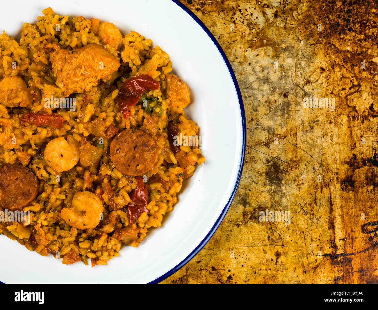 Chicken Smoked Chorizo and King Prawn Paella Meal On An Oven Tray Stock