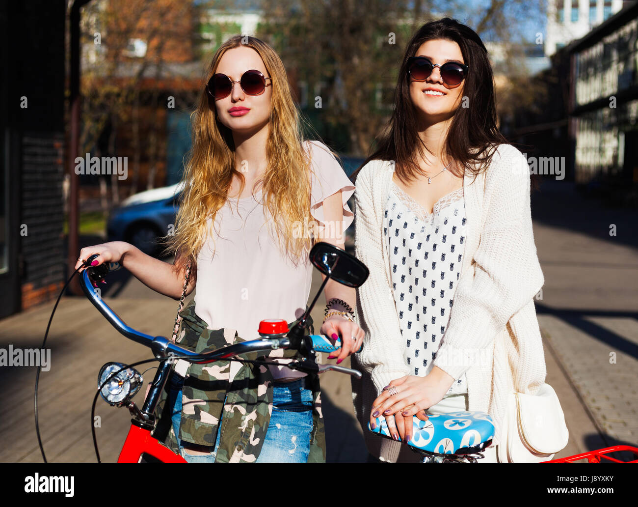 Two Girls on a bicycle. Lifestyle. Bestis. Stock Photo