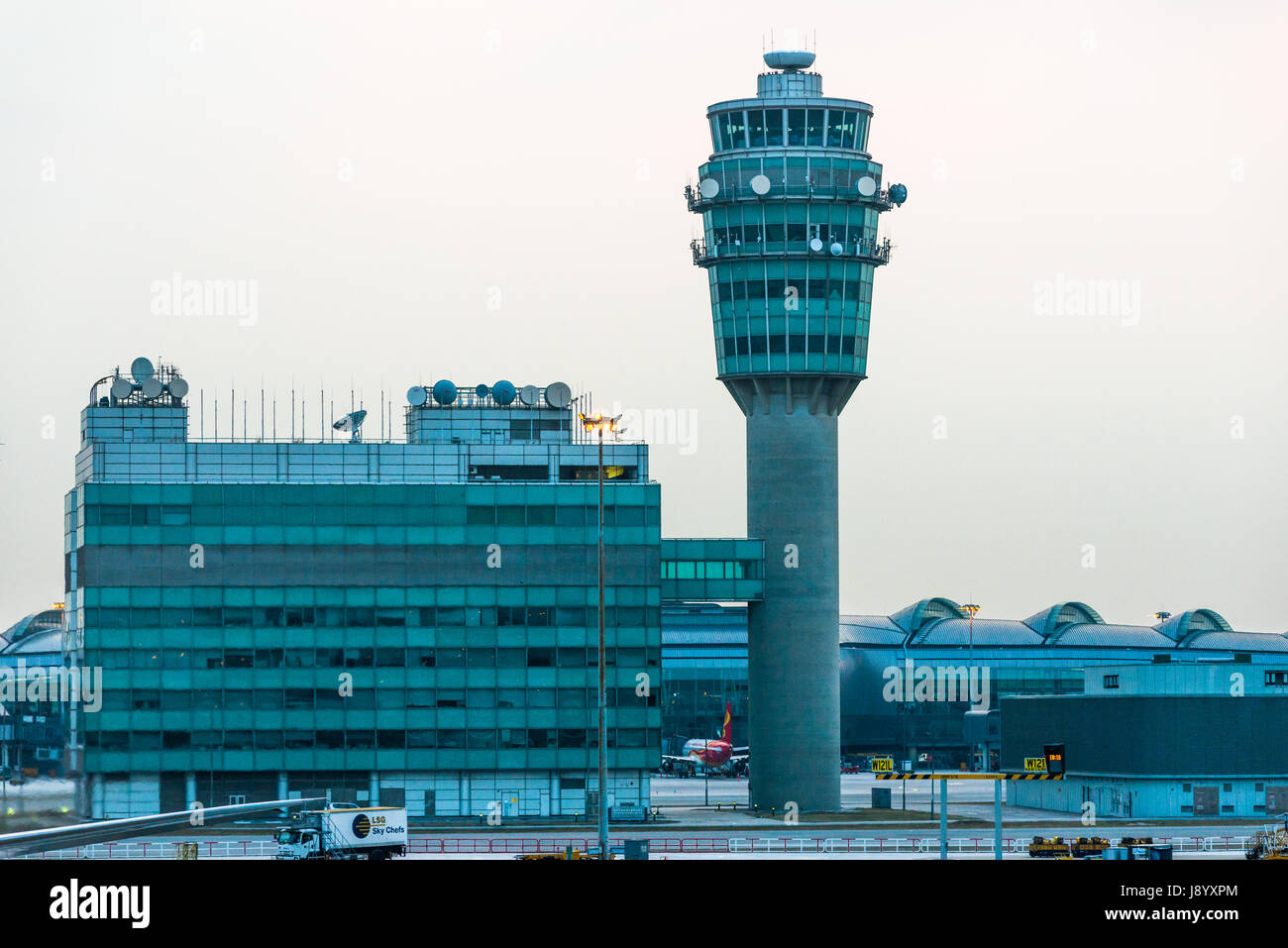 Hong Kong Airport Control tower at dusk. China. Stock Photo