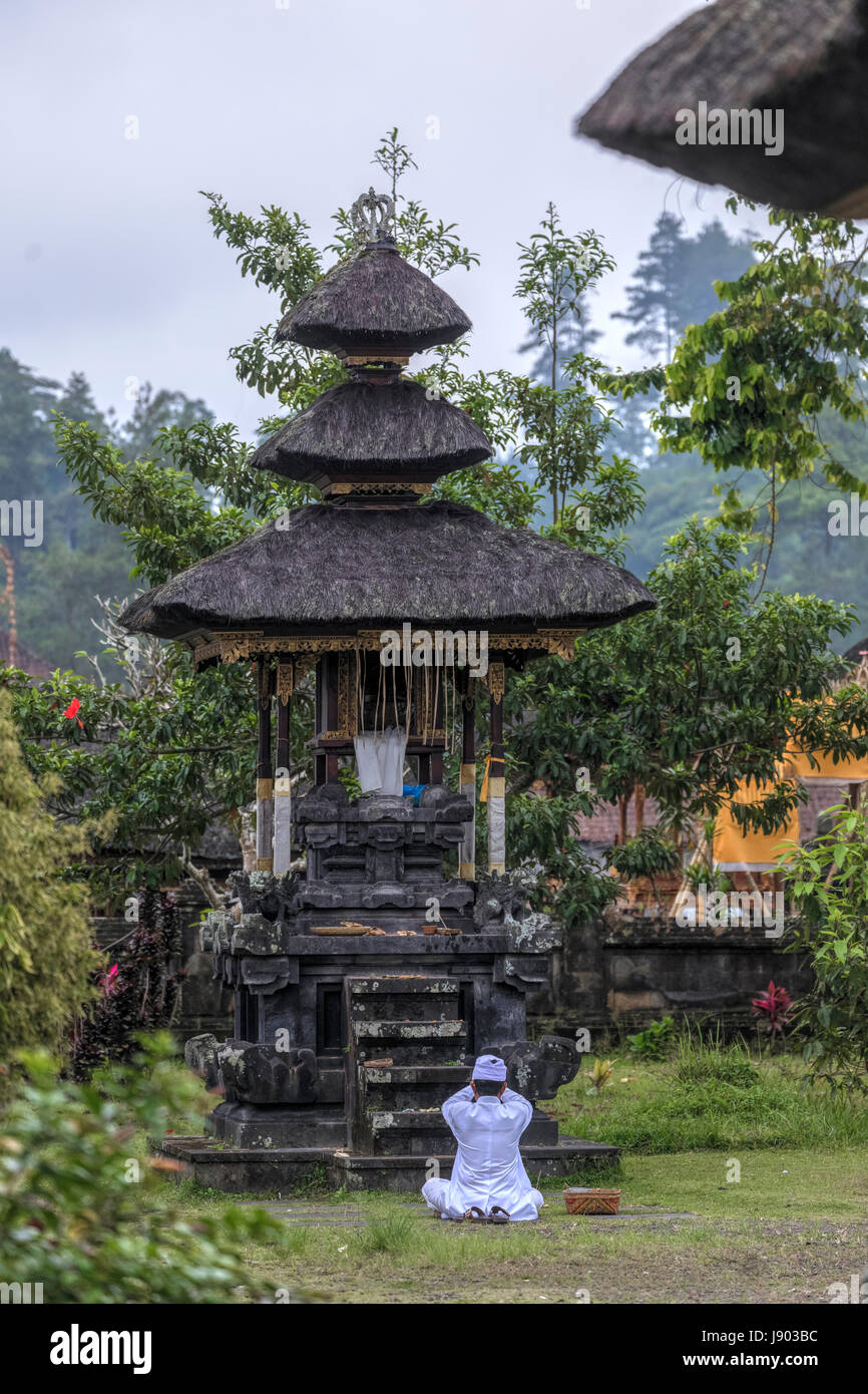 man praying in Pura Besakih, Bali, Indonesia, Asia Stock Photo