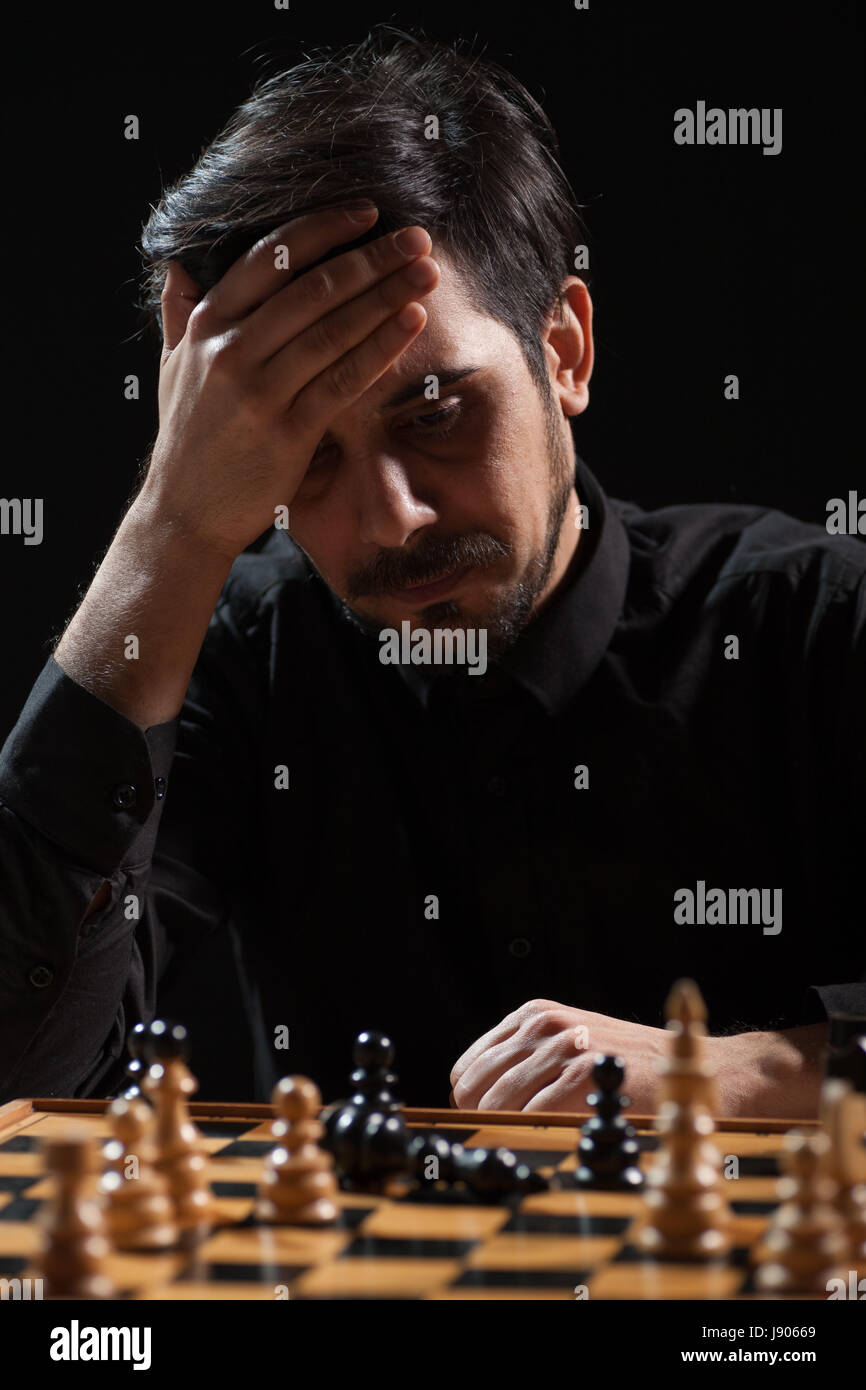 Portrait of adult man who capitulated in chess game. Stock Photo